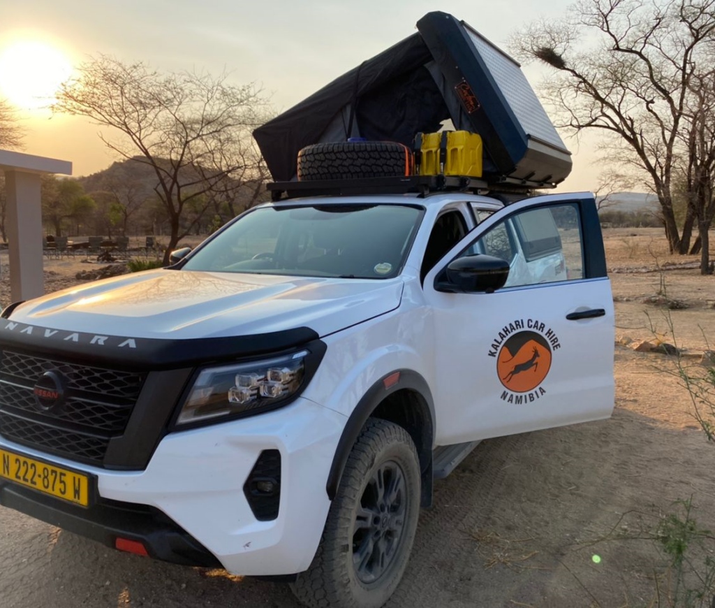 Nissan Navara Pro4x with hardtop roof tent on camp site