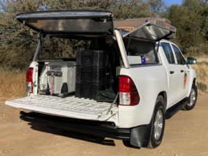 Toyota Hilux rental car canopy inside with camping equipment