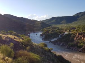 River crossing through mountaineous terrain at Epupa falls