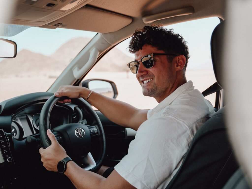 Business man in 4x4 rental car Namibia