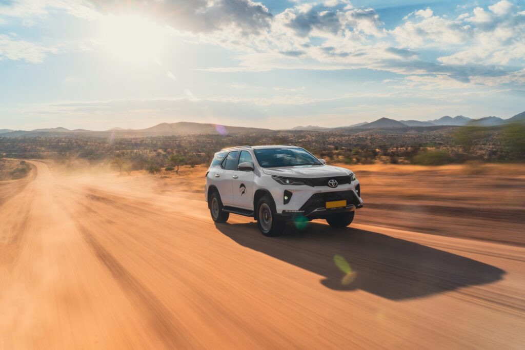 New Toyota Fortuner SUV 4x4 automatic rental car on gravel road