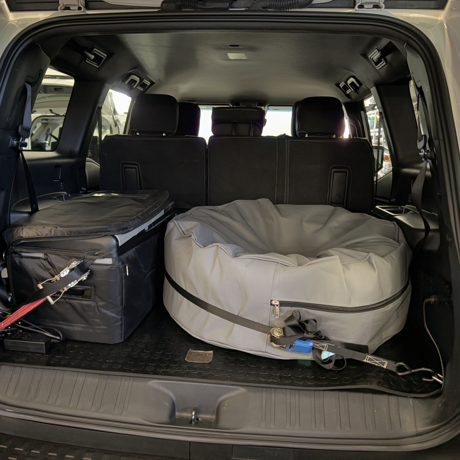 Luxury SUV trunk space with fridge and spare tyre inside